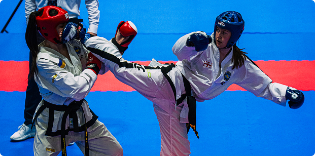 Two martial artists sparring mid-action